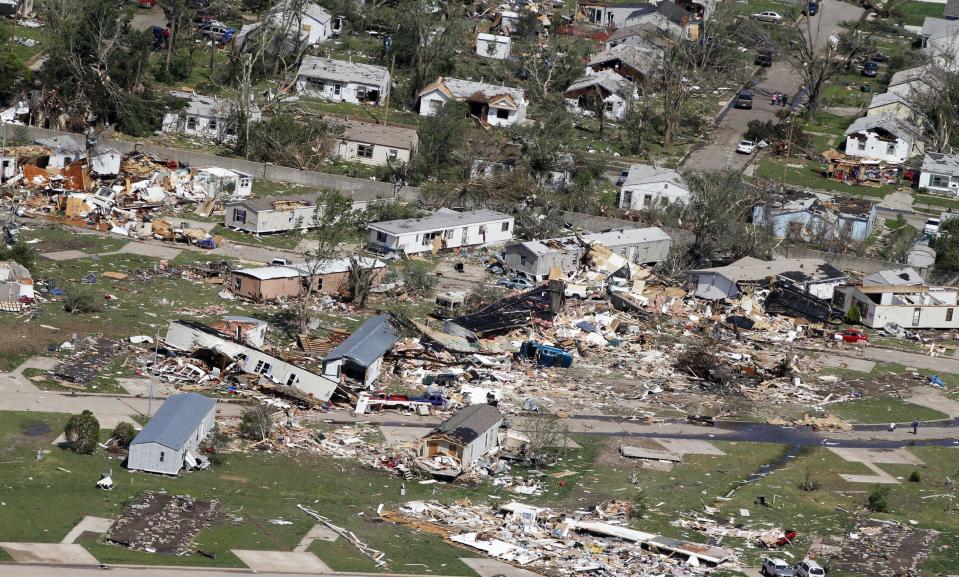 An aerial view of the destruction of the Oaklawn neighborhood in Wichita, Kansas, on Sunday, April 15, 2012. Residents of several states scoured through the wreckage of battered homes and businesses Sunday after dozens of tornadoes blitzed the Midwest and Plains Saturday night. (AP Photo/Jeff Tuttle)