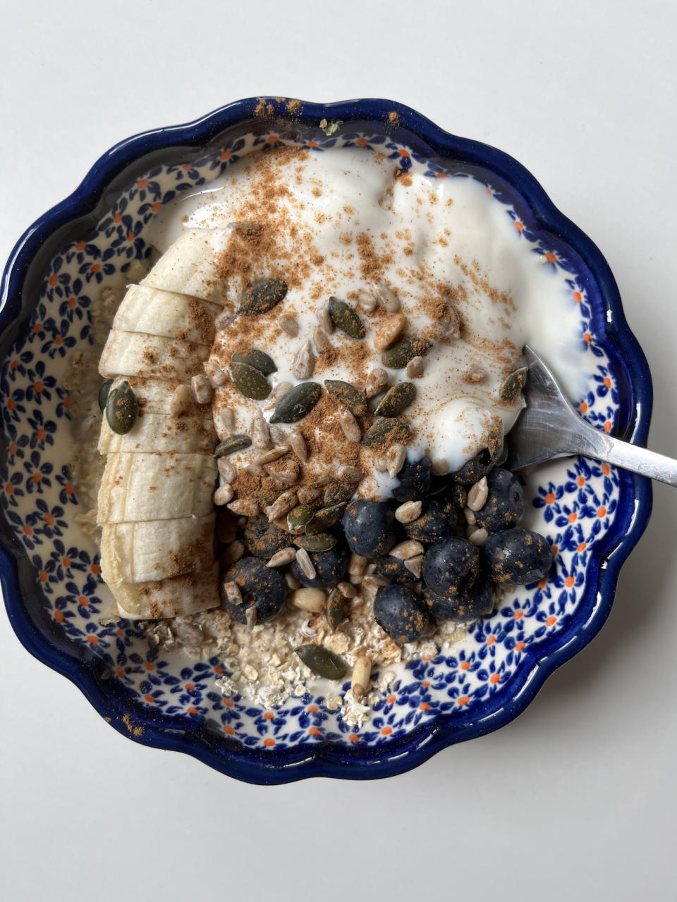 I have mine with oat milk, a giant dollop of soy yogurt, a mix of nuts and seeds, and a chopped banana and berries. I'm not sure if it's a weird pairing, but I'll usually have a few bits of cheese to polish off the meal. I got this plate when I was in Warsaw last weekend and feel like it makes every meal a little tastier. 