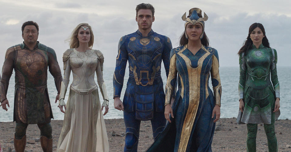 The stars of the Marvel film, Eternals standing in a row on a beach. Photo: Marvel Studios.