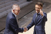 French President Emmanuel Macron, right, and Australian Prime Minister Anthony Albanese shake hands after addressinf reporters Friday, July 1, 2022 at the Elysee Palace in Paris. Australia and France opened a "new chapter" in relations as the new Australian prime minister seeks to heal wounds caused by a secret submarine contract that infuriated France. (AP Photo/ Thomas Padilla)