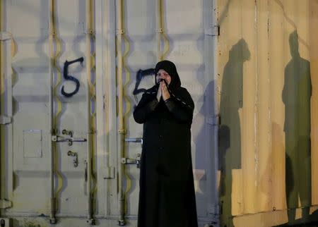 A woman cries at the site of a suicide attack in Kabul, Afghanistan August 7, 2015. REUTERS/Mohammad Ismail