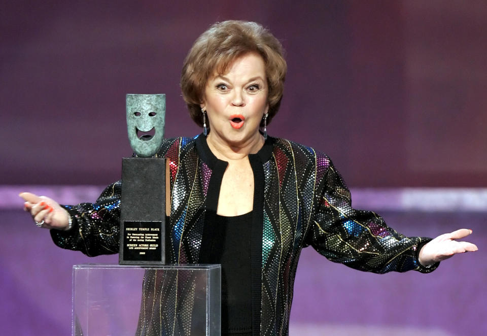 FILE - In this Jan. 29, 2006 file photo, Shirley Temple Black accepts the Screen Actors Guild Awards life achievement award at the 12th Annual Screen Actors Guild Awards, in Los Angeles. Shirley Temple, the curly-haired child star who put smiles on the faces of Depression-era moviegoers, has died. She was 85. (AP Photo/Mark J. Terrill, File)