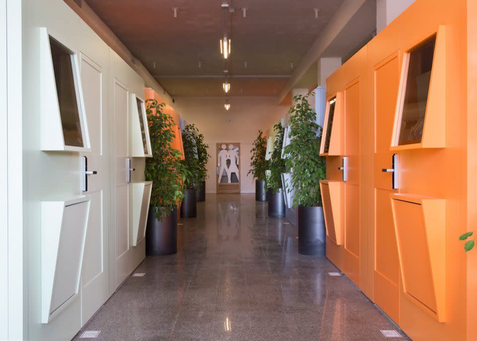 <p>There are 42 pods total. They face each other in rows, making a slight resemblance to prison cells. But white, tangerine, and light green colors give them vibrancy. </p>