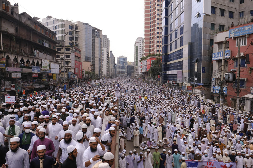 Thousands of Bangladeshi Muslims protesting the French president’s support of secular laws allowing caricatures of the Prophet Muhammad march to lay siege on the French Embassy in Dhaka, Bangladesh, Monday, Nov.2, 2020. (AP Photo/Mahmud Hossain Opu)