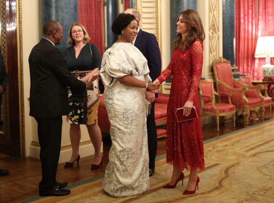 Prince William and Kate Middleton greet guests at Buckingham Palace reception