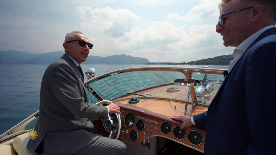 Ferretti Group CEO Alberto Galassi takes correspondent Seth Doane for a spin in his 1970 Riva Aquarama.   / Credit: CBS News