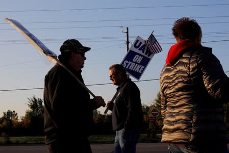 FILE PHOTO: Striking union workers walk the picket line outside the GM Flint Truck Assembly in Flint