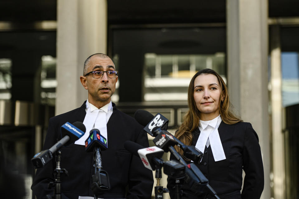 Crown prosecutor Neville Golwalla and assistant prosecutor Ana Serban speak to reporters after Peter Nygard was found guilty of four counts of sexual assault, in Toronto, on Sunday, Nov. 12, 2023. (Christopher Katsarov/The Canadian Press via AP)