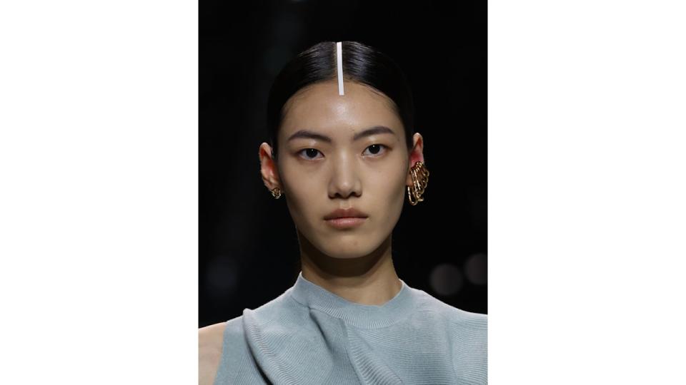 MILAN, ITALY - SEPTEMBER 20: A model, beauty detail, walks the runway at the Fendi fashion show during the Milan Fashion Week Womenswear Spring/Summer 2024 on September 20, 2023 in Milan, Italy. (Photo by Pietro D'Aprano/Getty Images)