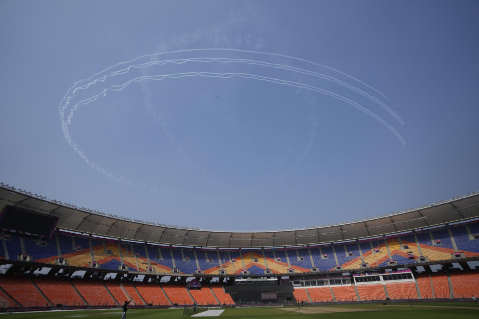 The Surya Kiran team of Indian Air Force performs aerobatic display over Narendra Modi stadium ahead of final match of ICC Men's Cricket World Cup between India and Australia in Ahmedabad, India, Friday, Nov. 17, 2023. (AP Photo/Ajit Solanki)