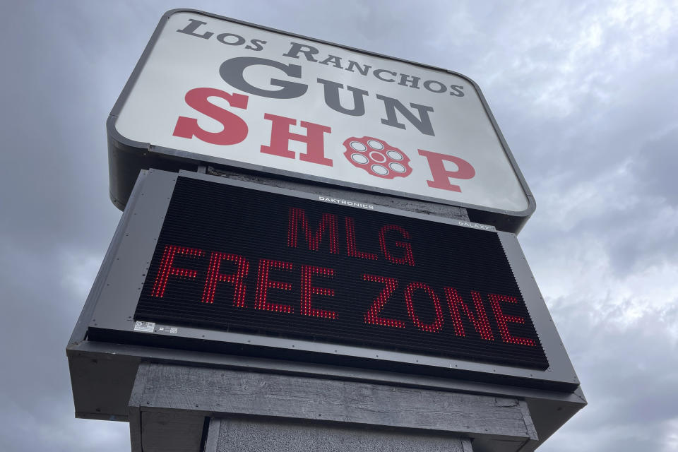 The marquee at a gun shop in Los Ranchos, N.M., flashes in protest of Gov. Michelle Lujan Grisham's order to suspend the carrying of firearms in the state's largest metro area on Monday, Sept. 11, 2023. (AP Photo/Susan Montoya Bryan)