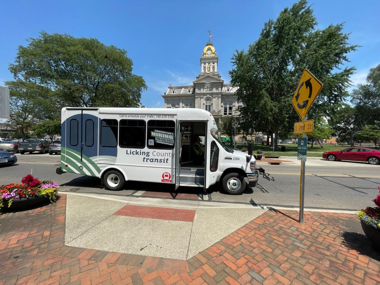 A Licking County Transit bus stops in downtown Newark along the new fixed route that makes 25 stops along East Main and West Main streets. The county will add a fixed-route to Granville in October.