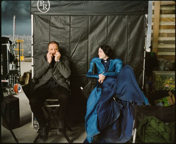<p>Searchlight Pictures</p> Director Yorgos Lanthimos and Emma Stone behind the scenes of Poor Things
