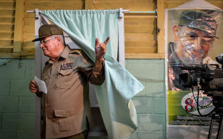 Cuban Vice-minister of Army Alvaro Lopez Miera casts his vote at a polling station in Nautico, Havana, on April 19, 2015, during municipal elections