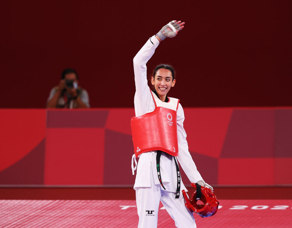 Kimia Alizadeh of the Refugee Olympic Team celebrates after competing in the Tokyo 2020 Olympics, on July 25, 2021.<span class="copyright">Murad Sezer—Reuters</span>