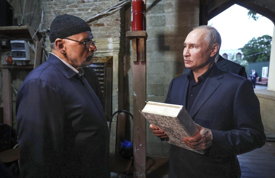 FILE - Russian President Vladimir Putin visits The Juma Mosque, the oldest mosque in Russia, in the center of the old city of Derbent on Wednesday, June 28, 2023, during his working visit to Dagestan Republic, Russia. After a chaotic and stumbling response to mercenary chief Yevgeny Prigozhin's mutiny, Putin tried to fix the damage to his standing with a series of events aimed at projecting an image of strength and authority. (Gavriil Grigorov, Sputnik, Kremlin Pool Photo via AP, File)
