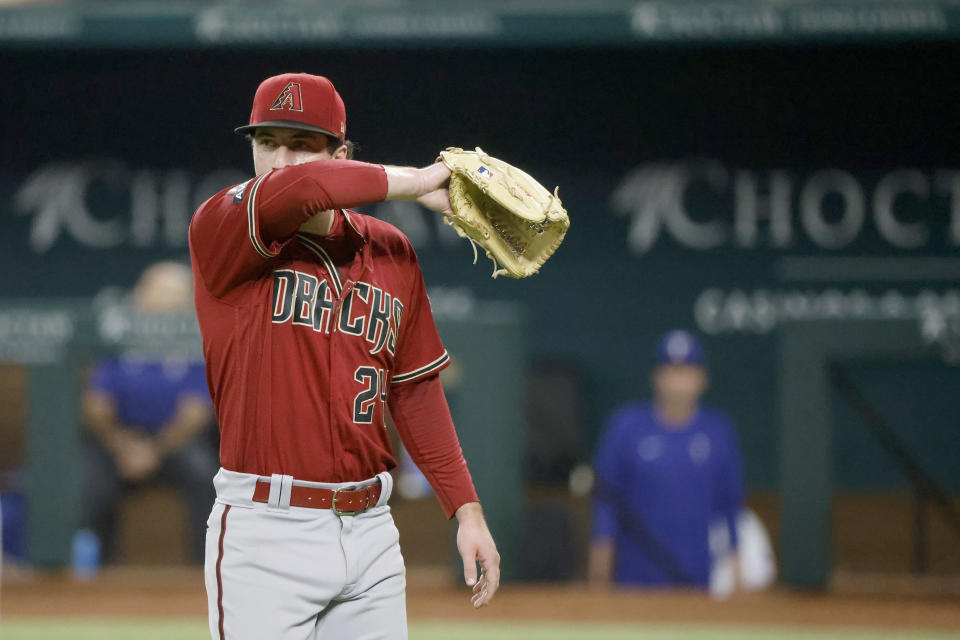 Arizona Diamondbacks relief pitcher Kyle Nelson (24) heads to the dugout after a pitching change during the ninth inning of a baseball game against the Texas Rangers, Tuesday, May 2, 2023, in Arlington, Texas. (AP Photo/Michael Ainsworth)