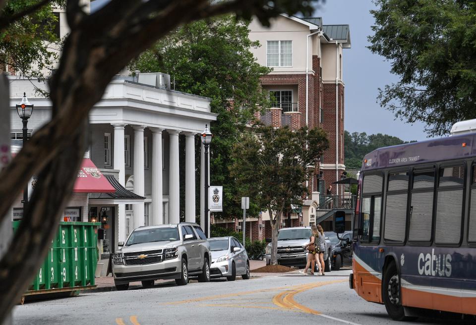 A CATbus drives along College Avenue in 2018 before reshaping the look of downtown Clemson with new businesses. The City of Clemson posted several signs with a notice of proposed variance. Good Shepherd Pavilion, a new hotel concept to Clemson was built, a five-story hotel with 72 rooms and suites.