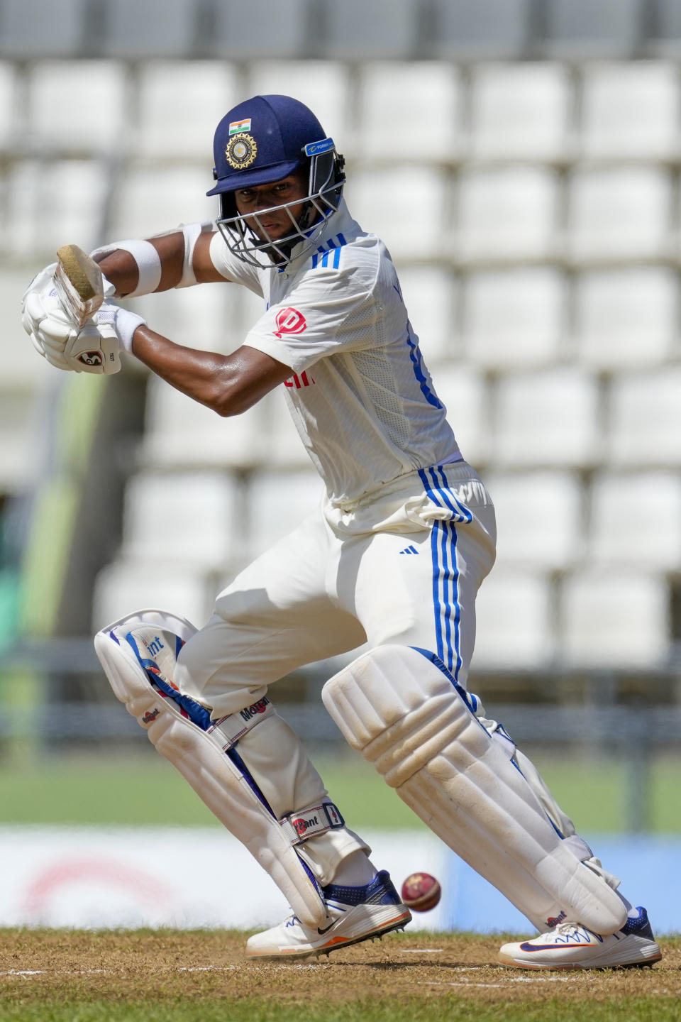 India's Yashasvi Jaiswal plays a shot from the bowling of West Indies' Jason Holder on day three of their first cricket Test match at Windsor Park in Roseau, Dominica, Friday, July 14, 2023. (AP Photo/Ricardo Mazalan)