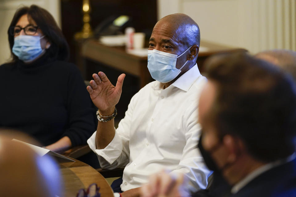 New York City Mayor Eric Adams, center, speaks during a cabinet meeting on his first day in office in New York, Saturday, Jan. 1, 2022. (AP Photo/Seth Wenig)