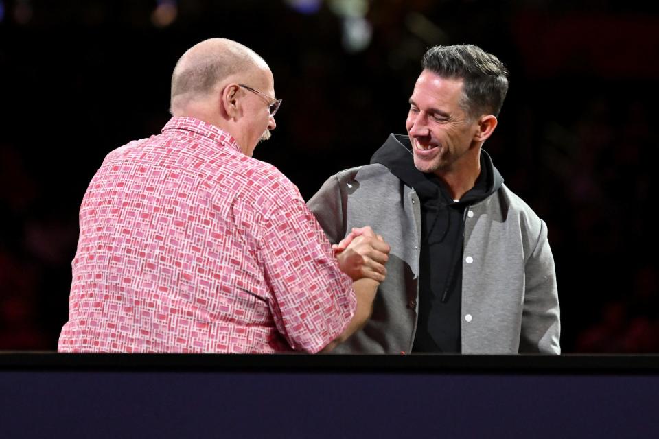 Chiefs head coach Andy Reid and 49ers head coach Kyle Shanahan meet on stage during Super Bowl Opening Night at Allegiant Stadium.