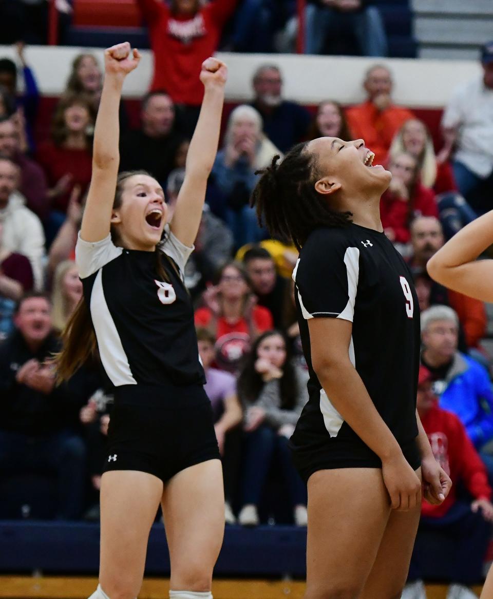 North Hagerstown's Sophia Williams, left, and Gabby Grantham-Medley celebrate the fourth-set win against Magruder in the Class 3A volleyball semifinals at Thomas Johnson.