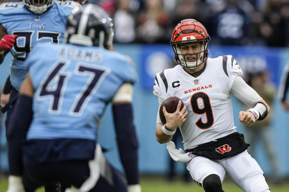 Cincinnati Bengals quarterback Joe Burrow (9) slides after a run against the Tennessee Titans during the first half of an NFL football game, Sunday, Nov. 27, 2022, in Nashville, Tenn. (AP Photo/Gerald Herbert)