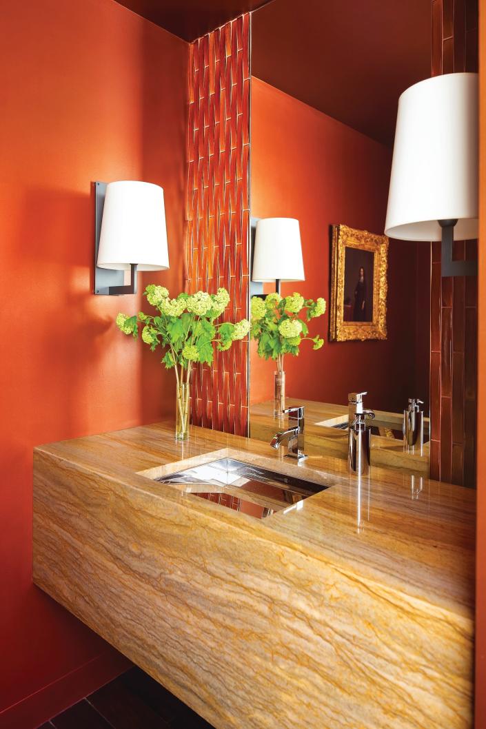 Curate the space around the vanity with statement tile and classy lighting fixtures.