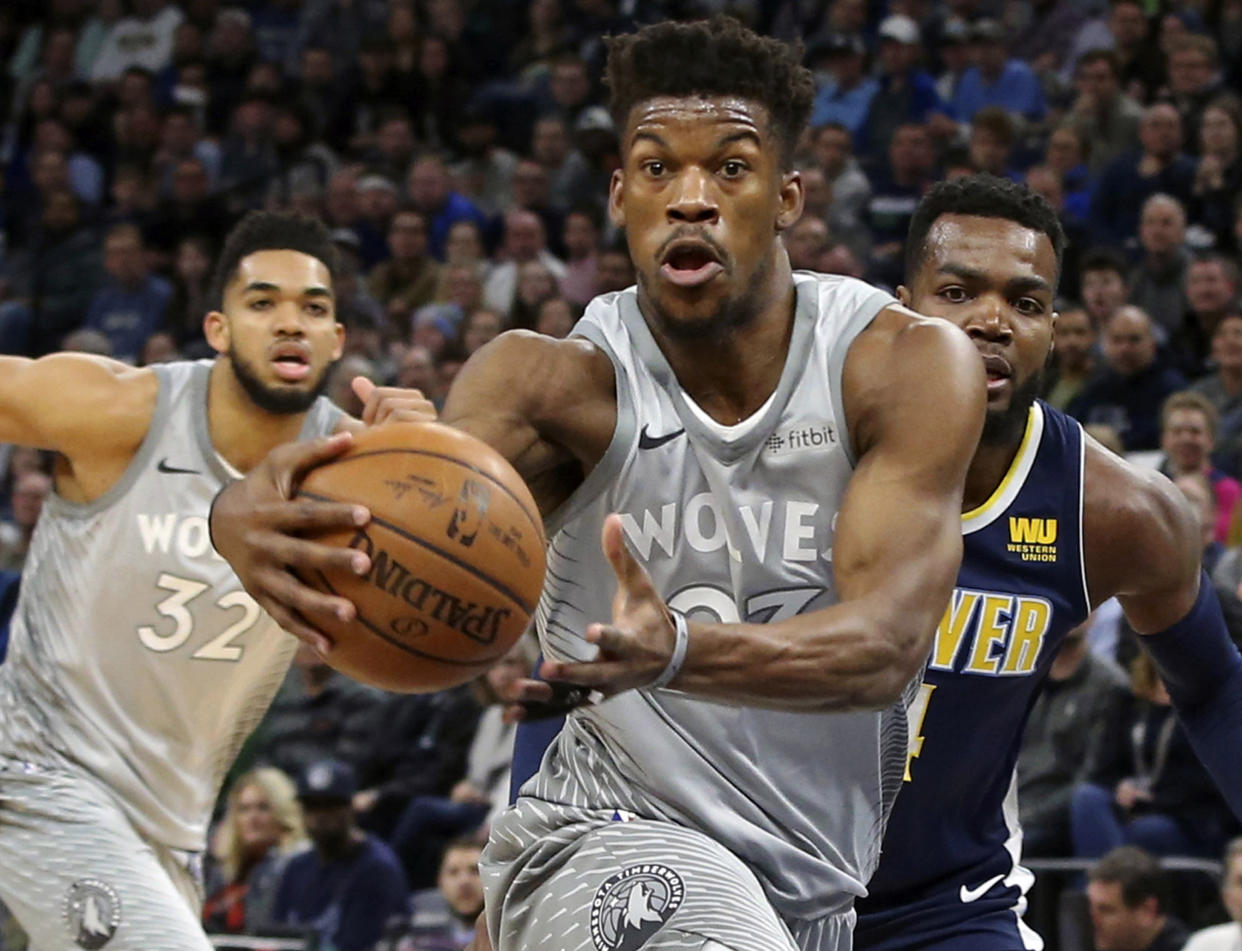 Jimmy Butler is heading to Philadelphia, Dario Saric and Robert Covington are headed to Minnesota and NBA Twitter has some thoughts. (AP Photo/Jim Mone)