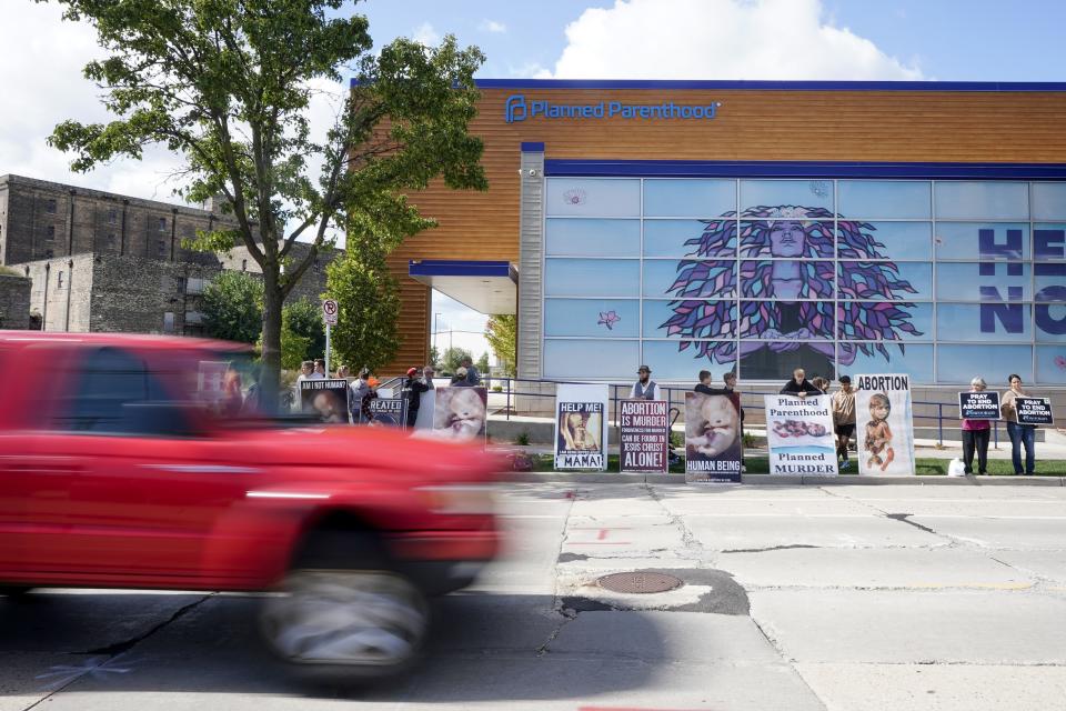 Protesters are seen outside Planned Parenthood, Monday, Sept. 18, 2023, in Milwaukee. (AP Photo/Morry Gash)