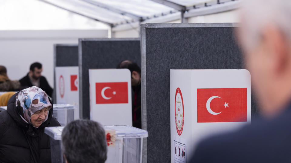 Voters cast their ballots for Turkey's parliamentary and presidential election at the Consulate General of Turkey in Huerth near Cologne, Thursday, April 27, 2023. Turks abroad can vote for Turkey's parliamentary and presidential elections until May 9, 2023. (Rolf Vennenbernd/dpa via AP)