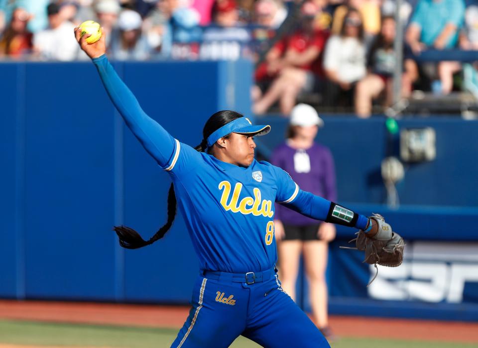 UCLA's Megan Faraimo pitches during the third inning of the team's NCAA softball Women's College World Series game against Northwestern on Friday, June 3, 2022, in Oklahoma City. (AP Photo/Alonzo Adams)