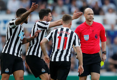 Soccer Football - Premier League - Newcastle United v Southampton - St James' Park, Newcastle, Britain - April 20, 2019 Southampton's James Ward-Prowse is shown a yellow card by referee Anthony Taylor as Newcastle United players react Action Images via Reuters/Lee Smith