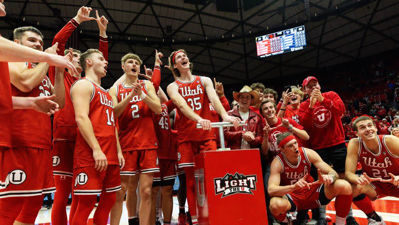 Utah Utes celebrate their victory over rival BYU during at the Jon M. Huntsman Center in Salt Lake City on Saturday, Dec. 9, 2023.