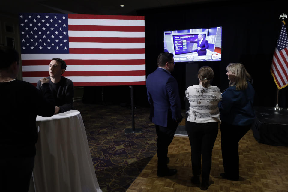 Supporters of Democratic presidential candidate former Vice President Joe Biden attend a primary election night rally, Tuesday, Feb. 11, 2020, in Nashua, N.H. (AP Photo/Steven Senne)