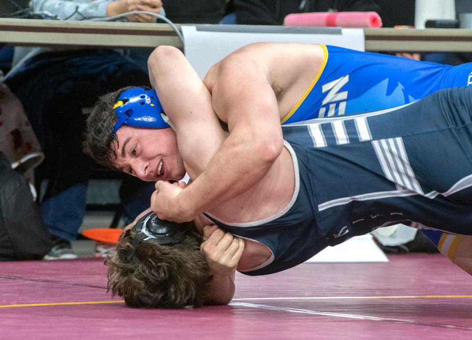 Linden's Anthony Cowan, top, grapples with Vista Del Lago's Dylan Kiel in the 215-lb weight class of the Sac-Joaquin Section Boys Masters Wrestling Tournament at the Adventist Health arena in downtown Stockton on Feb. 16, 2024.