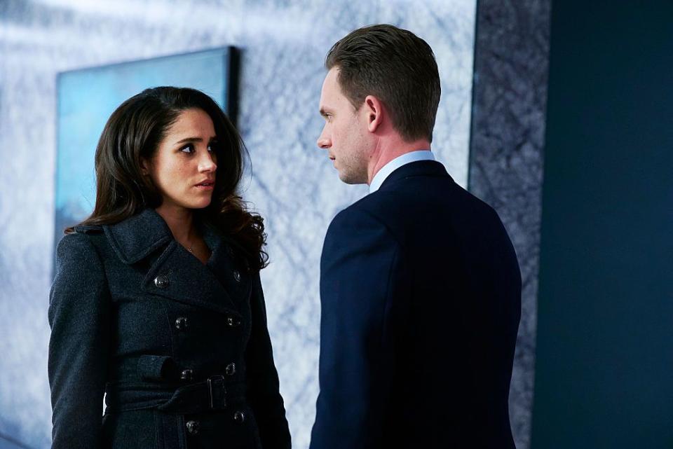 meghan markle as rachel zane and patrick j adams as michael ross from suits, looking at each other