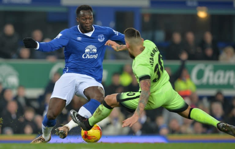 Manchester City's Nicolas Otamendi (R) challenges Everton's Romelu Lukaku in the Man City penalty area during their English League Cup semi-final first leg match, at Goodison Park in Liverpool, on January 6, 2016