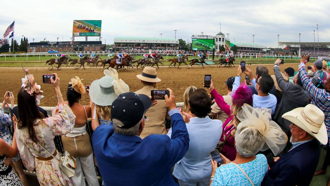 The field makes their way the first time around past the winner’s circle during the 149th running of the Kentucky Derby at Churchill Downs in Louisville, Ky., on Saturday, May 6, 2023. Mage won the Run for the Roses. Brian Simms/bsimms@herald-leader.com