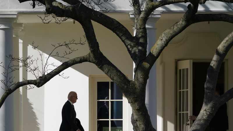 President Joe Biden walks to the Oval Office of the White House after stepping off Marine One, Monday, Jan. 16, 2023, in Washington. Biden’s approval rating has fallen near its lowest point in a new poll. 