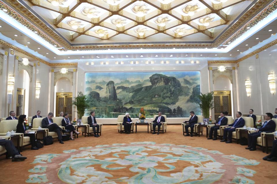 U.S. Treasury Secretary Janet Yellen, center left, meets Chinese Premier Li Qiang at the Great Hall of the People in Beijing, China, Sunday, April 7, 2024. Yellen, who arrived later in Beijing after starting her five-day visit in one of China's major industrial and export hubs, said the talks would create a structure to hear each other's views and try to address American concerns about manufacturing overcapacity in China. (AP Photo/Tatan Syuflana, Pool)