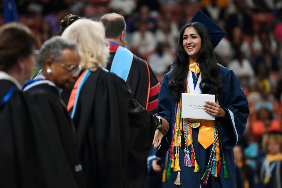 J.L. Mann valedictorian, Annika Krovi, receives her diploma during the Class of 2024 commencement ceremony at Bon Secours Wellness Arena on Wednesday, May 22, 2024.