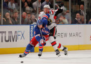 NEW YORK, NY - APRIL 21: Marc Staal #18 of the New York Rangers fights for the puck against Zack Smith #15 of the Ottawa Senators in Game Five of the Eastern Conference Quarterfinals during the 2012 NHL Stanley Cup Playoffs at Madison Square Garden on April 21, 2012 in New York City. (Photo by Mike Stobe/Getty Images)