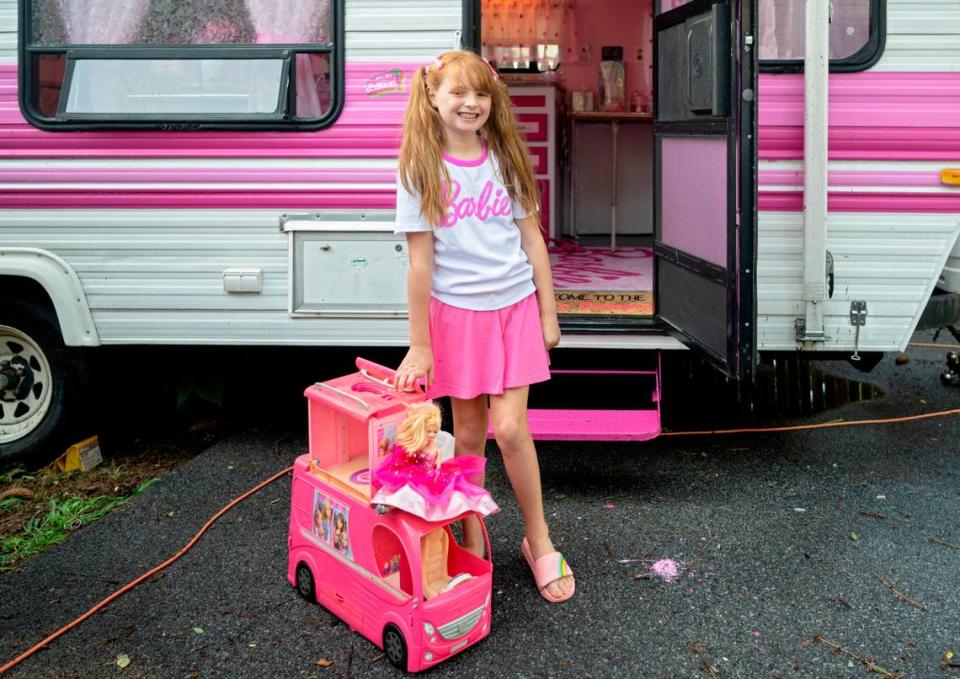 Jazmyn “Jazzy” Krammes with her toy Barbie camper outside of her family’s real life Barbie camper. Abby Drey/adrey@centredaily.com