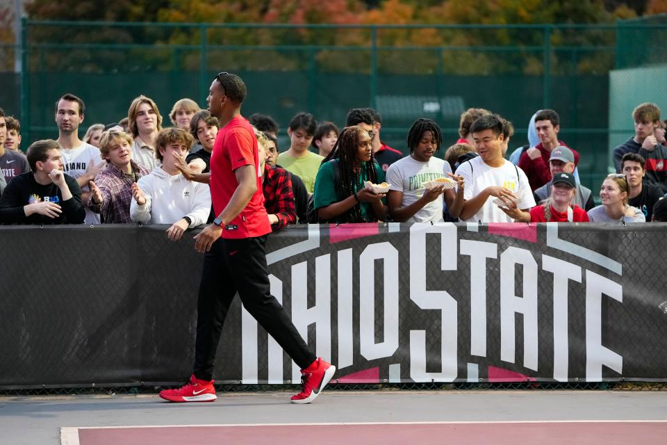 Oct 6, 2022; Columbus, OH, USA;  Ohio State men's basketball forward Zed Key (23) high fives fans during the “Buckeyes on the Blacktop” event on the rec basketball courts behind Ohio Stadium. Mandatory Credit: Adam Cairns-The Columbus Dispatch