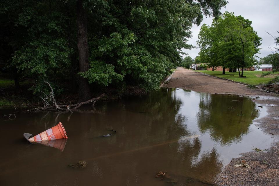 The corner of Harding Street and Monroe Street on May 13, 2024, is flooded after a rainy night in Jackson, Miss.