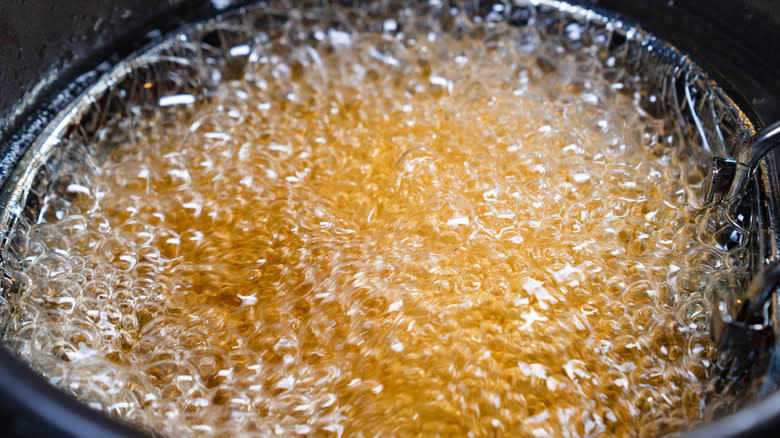 hot bubbling oil in fryer