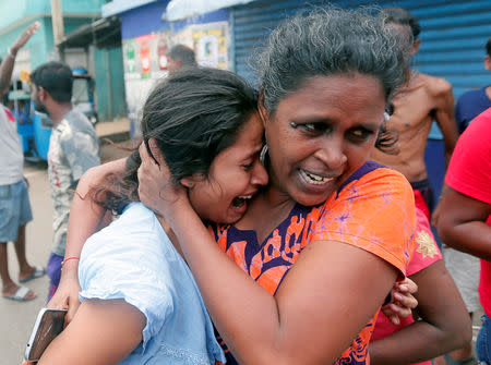 People who live near the church that was attacked yesterday, leave their houses as the military try to defuse a suspected van before it exploded in Colombo, Sri Lanka April 22, 2019. REUTERS/Dinuka Liyanawatte