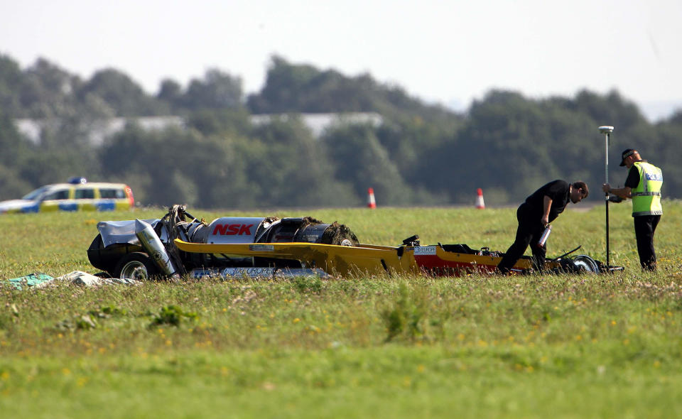 Police officers examine the car that Top Gear presenter Richard Hammond crashed in, at Elvington airfield near York.   (Photo by Owen Humphreys - PA Images/PA Images via Getty Images)