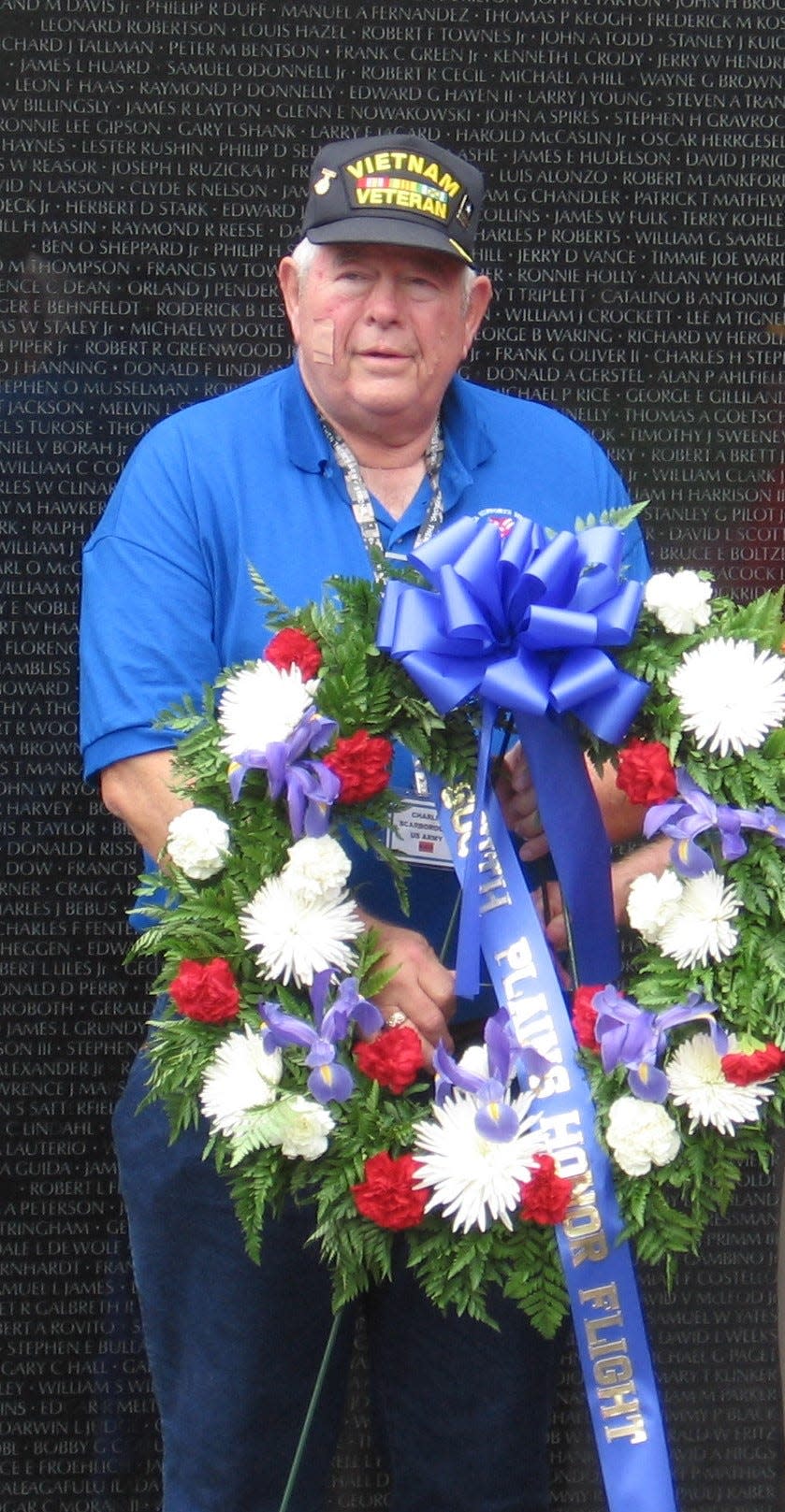 In this undated photo, Charlie Scarborough participates in a wreath laying at at Vietnam Memorial during a South Plains Honor Flight.